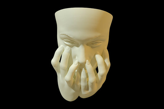3D‑printed wall sculpture of a stylized face with closed eyes and multiple hands covering the mouth and chin