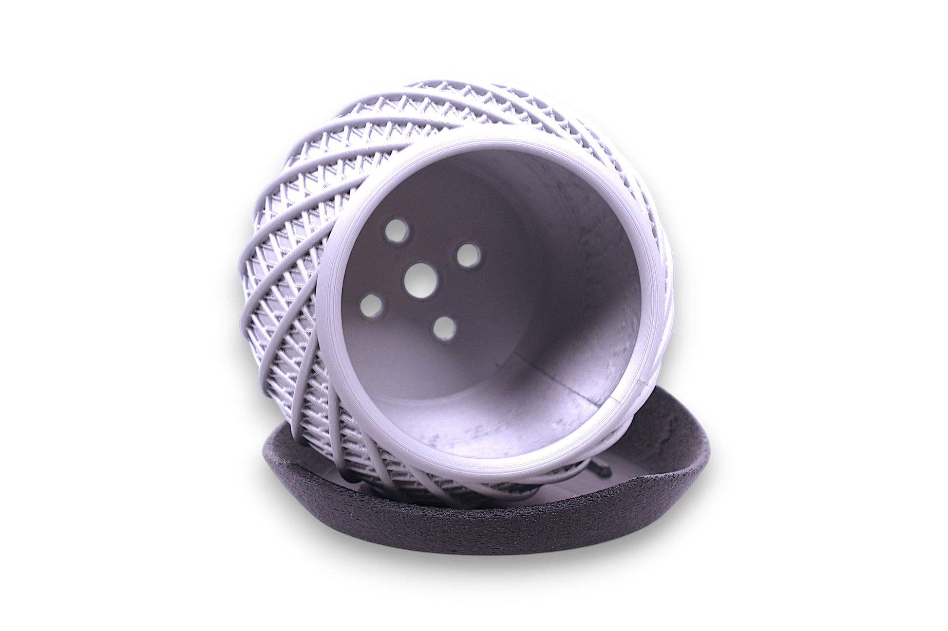 Silver PLA component – 3D printed with lattice texture and five-hole end cap, displayed on black padded base
