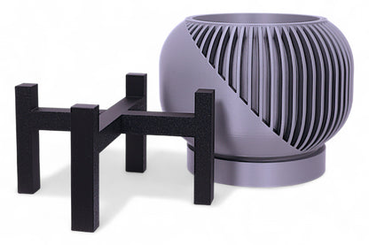 Silver planter with ribbed top and smooth base on black stand