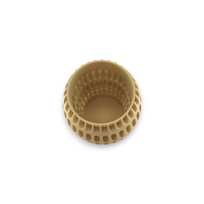 Top view of a beige, cylindrical vase with a perforated design. The vase has a series of evenly spaced, oval-shaped holes around its outer surface, creating a textured pattern. The interior of the vase is smooth, with a solid base.