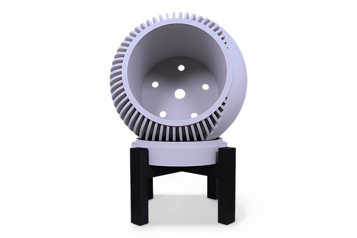 Gray planter with vertical slats next to black stand with horizontal supports