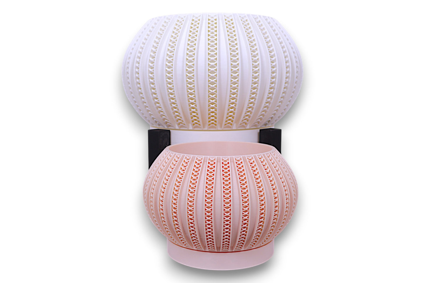 Stacked white and blush pink planters with triangular cutouts separated by black support